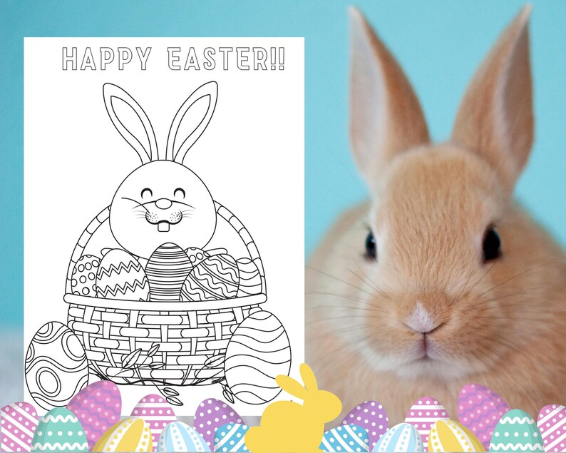 May include: A black and white coloring page featuring a bunny rabbit holding a basket full of Easter eggs. The text "HAPPY EASTER!" is at the top of the page. A real bunny rabbit is in the background.