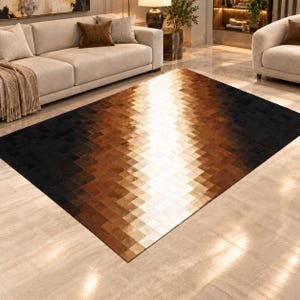 May include: A rectangular area rug featuring a geometric patchwork design composed of small square tiles. The color palette transitions in a gradient from deep black at the edges to dark brown, light brown, and a bright white center stripe.