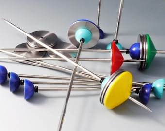 Fast support spindle &quot;Diskus&quot; with weight discs and interchangeable yarn spools