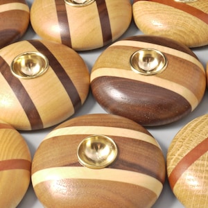 Brass spinning bowl with wooden base