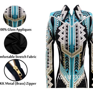 May include: A black show jacket with a turquoise, white, and black geometric pattern. The jacket has a zipper closure and is embellished with rhinestones and glass appliques. The jacket is made of a stretch fabric and has a YKK metal zipper.