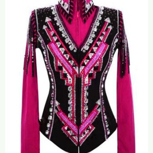 May include: A black and pink show jacket with a geometric design and rhinestones. The jacket has a zipper closure and long sleeves.