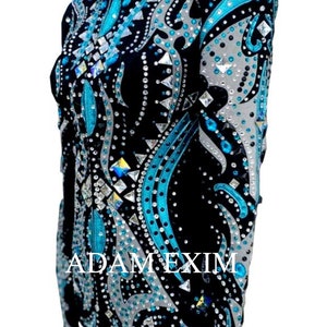 May include: A black show shirt with a turquoise and silver design. The shirt is covered in rhinestones and has the text "ADAM EXIM" on the front.
