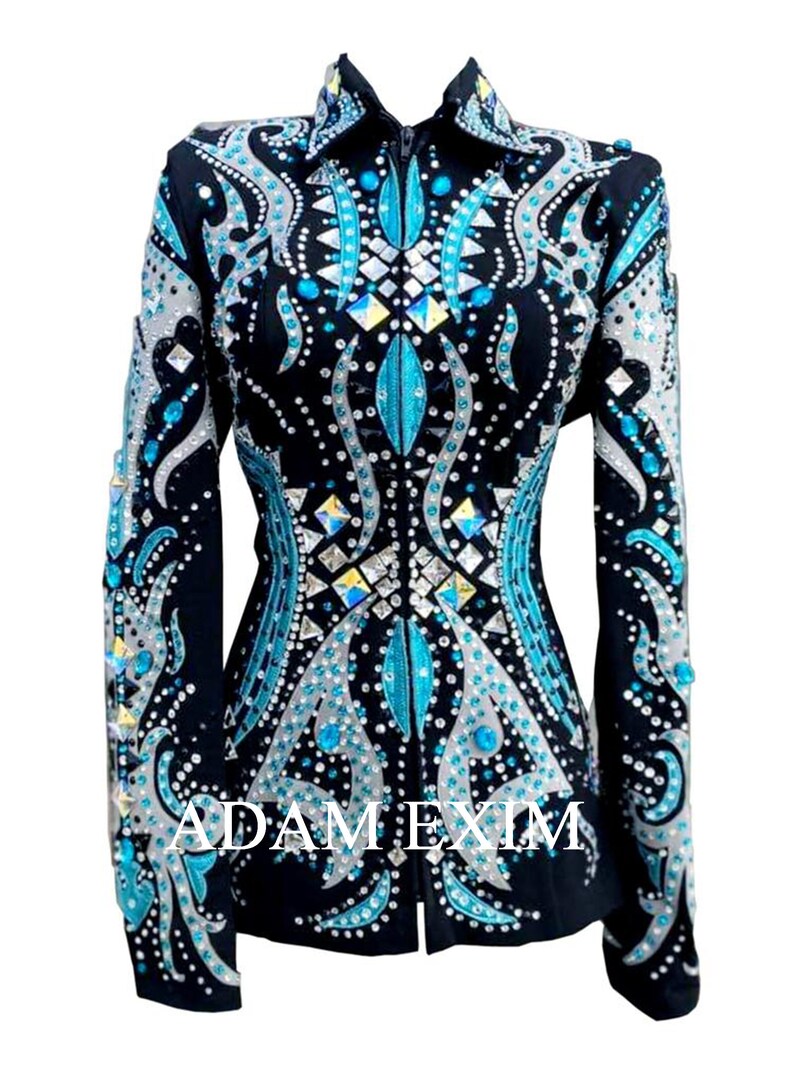 May include: A black show jacket with a teal and silver design. The jacket is embellished with rhinestones and has a zipper closure. The text "ADAM EXIM" is visible on the front of the jacket.