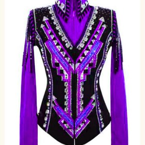 May include: Purple and black show jacket with a geometric design and rhinestones. The jacket has a zipper closure and long sleeves.