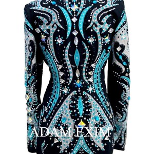 May include: Black show jacket with a teal and silver design featuring rhinestones and the text "ADAM EXIM".