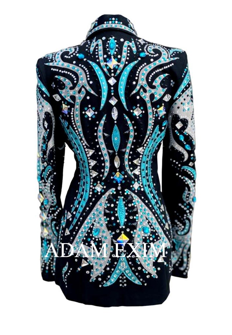 May include: Black show jacket with a teal and silver design featuring rhinestones and the text "ADAM EXIM".