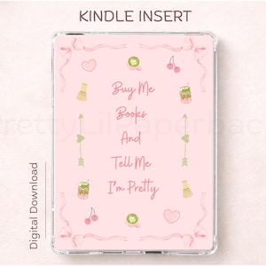 May include: A pink Kindle insert with the text "Buy Me Books And Tell Me I'm Pretty." The design includes illustrations of cherries, hearts, matcha lattes, and bows. The words "Kindle Insert" and "Digital Download" are also visible.