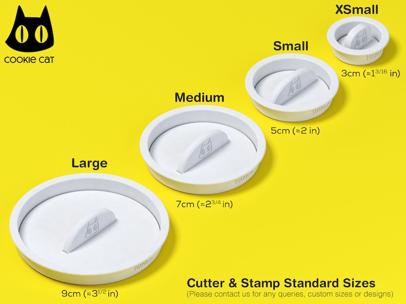 May include: Four white plastic cookie cutters in different sizes, labelled "XSmall", "Small", "Medium", and "Large". The cutters are shaped like a cat head with a small handle on the top. The cutters are on a yellow background. The text "Cookie Cat" is in the top left corner of the image. The text "Cutter & Stamp Standard Sizes" is at the bottom of the image. The text "(Please contact us for any queries, custom sizes or designs)" is below the text "Cutter & Stamp Standard Sizes".