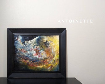 May include: A framed abstract oil painting with swirling colors of blue, yellow, red, and white. The painting is in a black frame and the artist's signature is visible in the bottom right corner.
