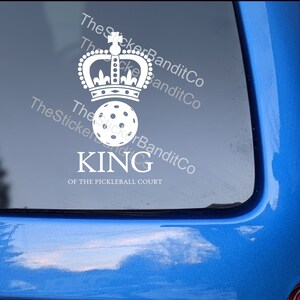 May include: White vinyl sticker with a crown and a pickleball. The text reads "King of the Pickleball Court".