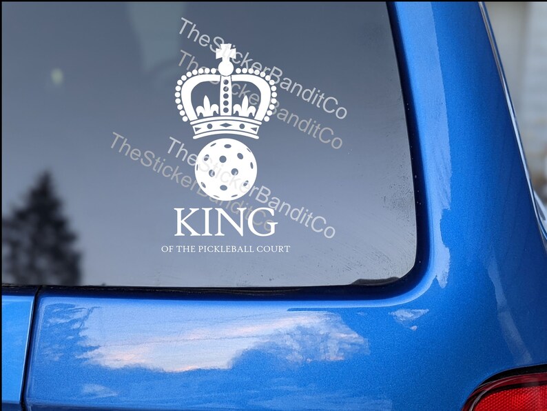 May include: White vinyl sticker with a crown and a pickleball. The text reads "King of the Pickleball Court".