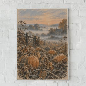 May include: A framed art print depicting a rural landscape at sunrise with a misty field, a wooden fence, and several orange pumpkins in the foreground. The scene features a small stone house nestled among trees under a soft, warm-toned sky.