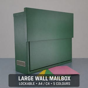 May include: A dark green wall-mounted mailbox with a rectangular shape. The mailbox features a hinged door and a small metal plate. The image includes the text "LARGE WALL MAILBOX LOCKABLE • A4 / C4 • 5 COLOURS".