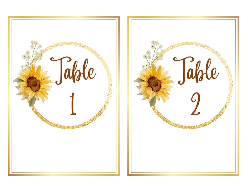 May include: Two table number cards with a gold circle and sunflower design. The text on the cards reads "Table 1" and "Table 2".