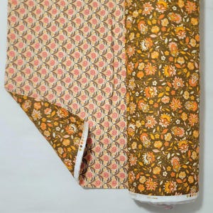 May include: A set of three ceramic mugs with a speckled, matte finish. The mugs are in shades of cream, light gray, and dark gray. Each mug has a simple, minimalist design and a rounded handle.