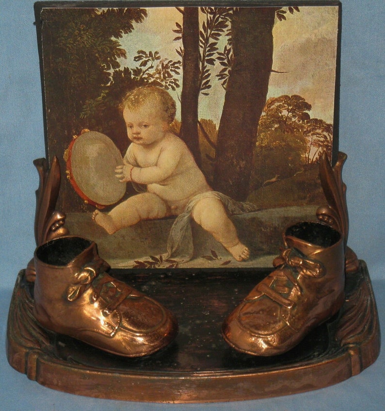 Vintage copper finish metal picture frame and baby shoes w/ image 1