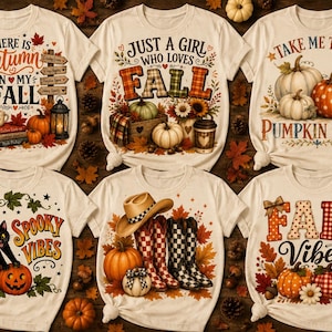 Könnte beinhalten: Sechs cremefarbene T-Shirts mit herbstlichen Grafikdrucken. Die Motive zeigen Kürbisse, Sonnenblumen, eine schwarze Katze, Cowboystiefel und Schriftzüge wie There is autumn in my fall, Just a girl who loves fall und Take me to the pumpkin patch.