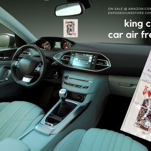 May include: A car air freshener featuring a King of Hearts playing card design. The air freshener is packaged in a clear plastic bag with the text "EXP Designs Air Fresheners" printed on it.