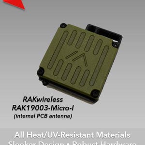 May include: An olive green laser-engraved case for Meshtastic devices. The case features a rectangular design with a series of engraved lines and a black antenna port. The text "RAKwireless RAK19003-Micro-I" is visible. The image also includes the text "NEW UPDATE!"