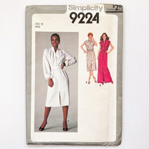 May include: Simplicity sewing pattern number 9224 for a dress. The pattern includes three different styles: a long-sleeved dress with a high collar, a short-sleeved dress with a collar, and a long dress with a collar. The pattern is for sizes 12-18.