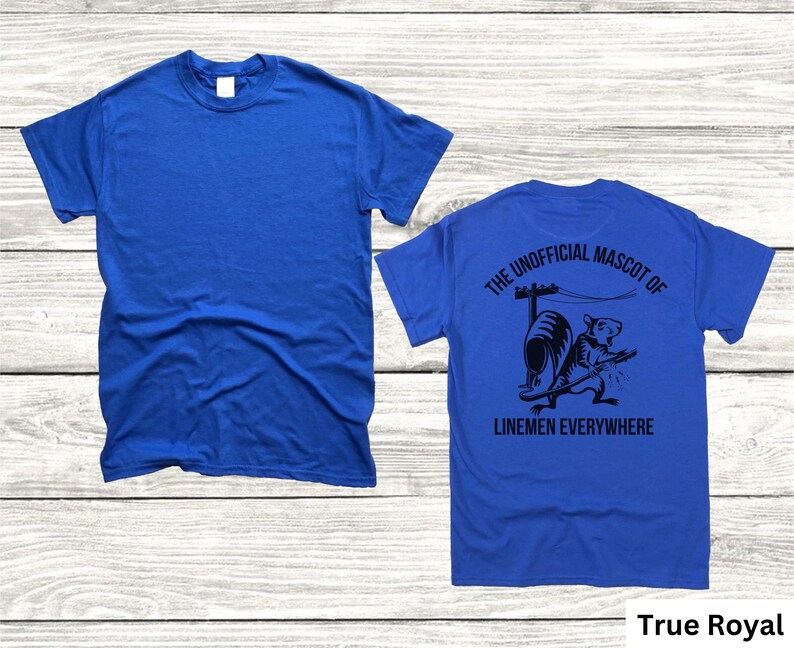 May include: True Royal blue t-shirt. The front of the shirt is plain. The back of the shirt features a black graphic of a rat with the text "THE UNOFFICIAL MASCOT OF LINEMEN EVERYWHERE".
