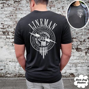 May include: Black t-shirt with a white graphic of a fist holding a lightning bolt. The graphic is surrounded by a circle with the text "Lineman Brotherhood of a Dying Breed" and "Life on the Line".