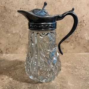 Antique Glass Cruet with ornate hinged silver plate lid