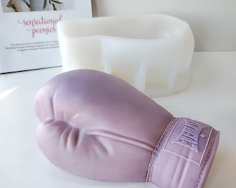 May include: A purple silicone mold shaped like a boxing glove with the word "Everlast" on the wrist strap.