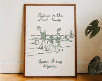 May include: A framed print with a green illustration of three people in hats, with the text "Rejoice in the Lord always" and "Again I say Rejoice" in a cursive font.