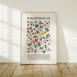 May include: A framed print with a white background and a floral design in shades of pink, blue, yellow, and green. The print features the text "Philippians 4:8" and a Bible verse about thinking about good things.