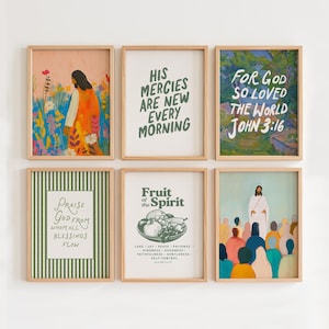 May include: A set of six framed wall art prints featuring religious themes, including illustrations of figures in landscapes, a bowl of fruit, and various text-based designs with phrases like His Mercies Are New Every Morning and John 3:16.