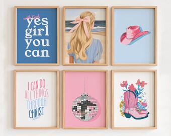 May include: Six framed prints with various designs. The top row features a blue print with the text "with God yes girl you can", a print with a blonde woman with a pink bow in her hair, and a light blue print with a pink cowboy hat. The bottom row features a print with the text "I can do all things through Christ", a pink print with a silver disco ball, and a print with pink cowboy boots and flowers.