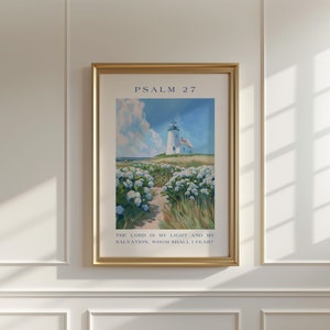 May include: A framed print featuring a painting of a lighthouse on a coastline with white flowers. The text "PSALM 27" is at the top of the print. The text "THE LORD IS MY LIGHT AND MY SALVATION, WHOM SHALL I FEAR?" is at the bottom of the print.