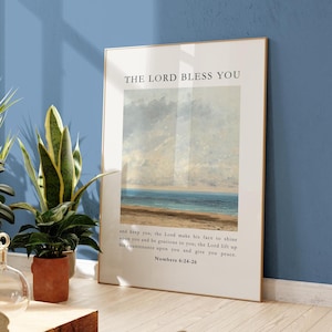 May include: A framed print with a seascape painting and a quote from the Bible: "The Lord bless you and keep you; the Lord make his face to shine upon you and be gracious to you; the Lord lift up his countenance upon you and give you peace." Numbers 6:24-26