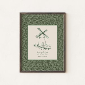 May include: A framed print with a green background and a white border. The print features a black and white illustration of a windmill with the text "Trust in the Lord with all your heart" and "Proverbs 3:5".