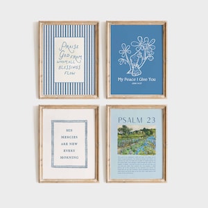 May include: Four framed art prints with inspirational quotes. The prints feature text in various fonts and styles, including "Praise God From Whom All Blessings Flow" and "My Peace I Give You." The frames are a light brown color.