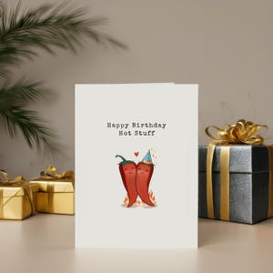Bring some spice to their birthday with this playful, pun-filled card featuring two red chili peppers holding hands in love! Perfect for the hot stuff in your life, this fun design is a great way to show your love to a partner who brings the heat!
