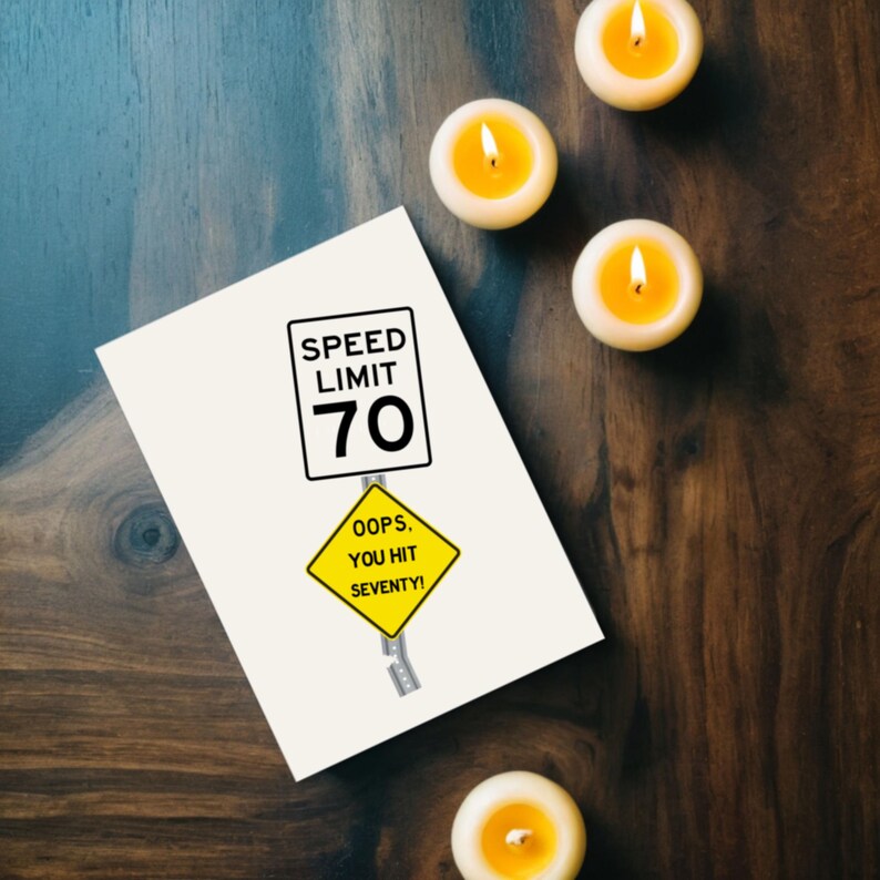 Celebrate their 70th birthday with a funny 'Oops You Hit 70' Birthday Card, shown next to glowing yellow candles. This charming combination adds a memorable touch to their special birthday.
