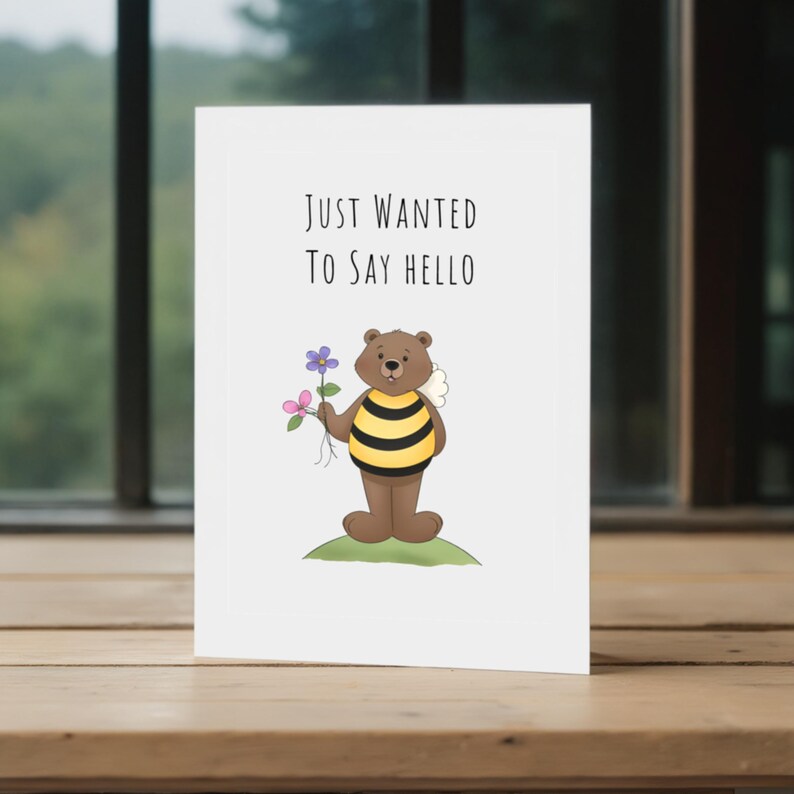 This picture shows the 'Just Wanted To Say Hello' Card in front of a window with trees in the background, highlighting a peaceful view.