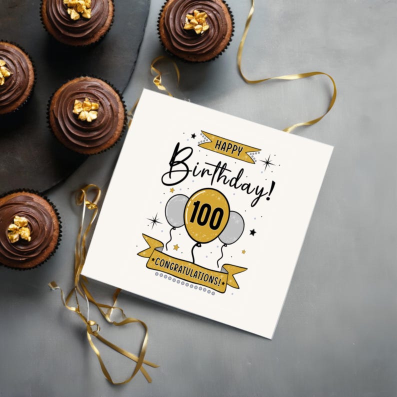 Celebrate their 100th birthday with our elegant Happy 100th Birthday card, beautifully presented next to chocolate cupcakes.