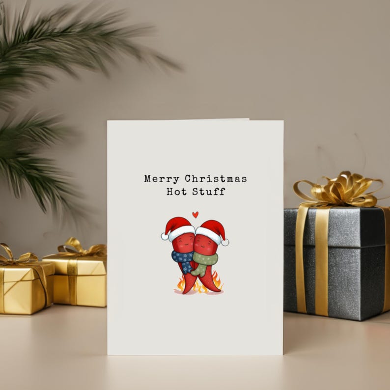 This card features two cute hot peppers hugging with a flame underneath and Santa hats for a holiday touch. The message Merry Christmas Hot Stuff adds a cute vibe, perfect for your partner this Christmas, showcased next to presents