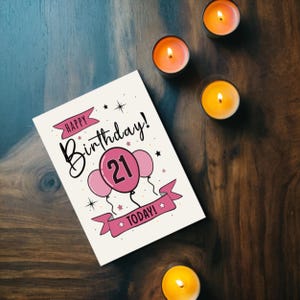 Mark their 21st birthday with our lovely Happy 21st Birthday card, displayed alongside glowing yellow and red candles. This charming combination brings a warm and memorable touch to their special day