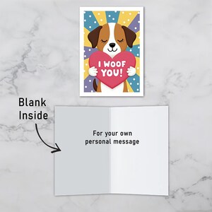 Dog-themed Valentine greeting card where you can write your own message inside. The front shows a smiling brown and white puppy holding a heart that reads I Woof You on a cheerful dotted background.