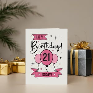 Honor their 21st birthday with our lovely Happy 21st Birthday Card, showcased next to birthday presents. This charming card adds a special touch, enhancing their celebration and making their milestone birthday even more memorable.