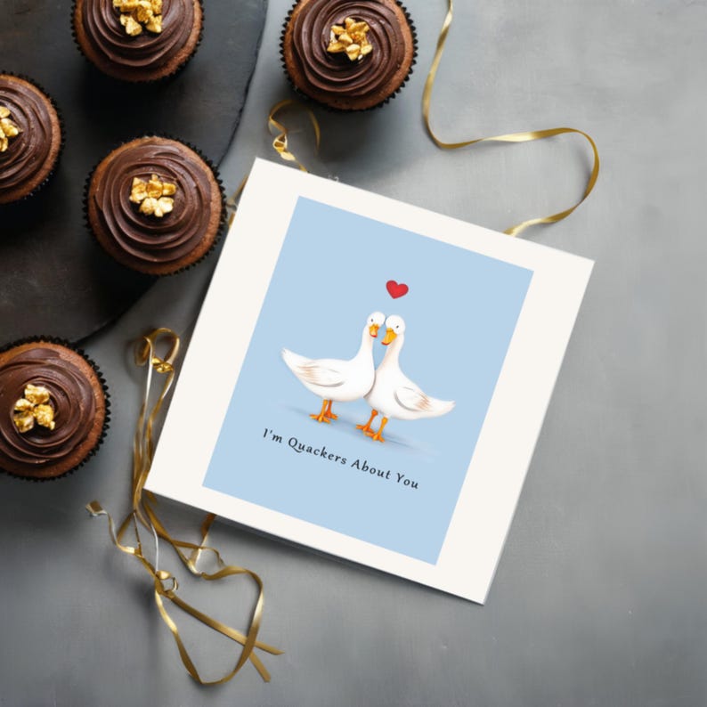 Displayed on a table next to delicious chocolate cupcakes, the I'm Quakers About You Anniversary Card adds a sweet and charming touch to the celebration.