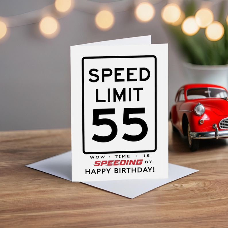 Celebrate their 55th birthday with a charming Speed Limit Birthday Card, beautifully displayed alongside a classic red model car. This delightful pairing adds a nostalgic touch to their special birthday.