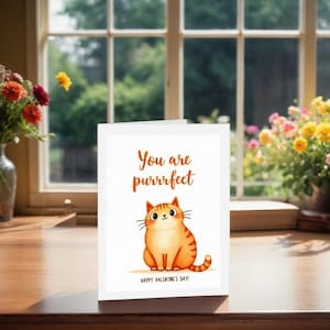 Charming Valentine card displayed next to treats. The illustration includes an orange cat with whiskers and the phrase You are purrrfect on a clean background.