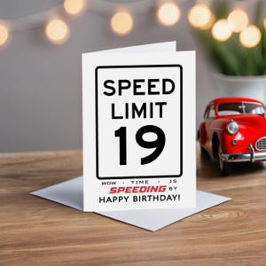 Celebrate their 19th birthday with our Speed Limit Birthday Card, beautifully displayed alongside a classic red model car. This delightful pairing adds a nostalgic touch to their special birthday.
