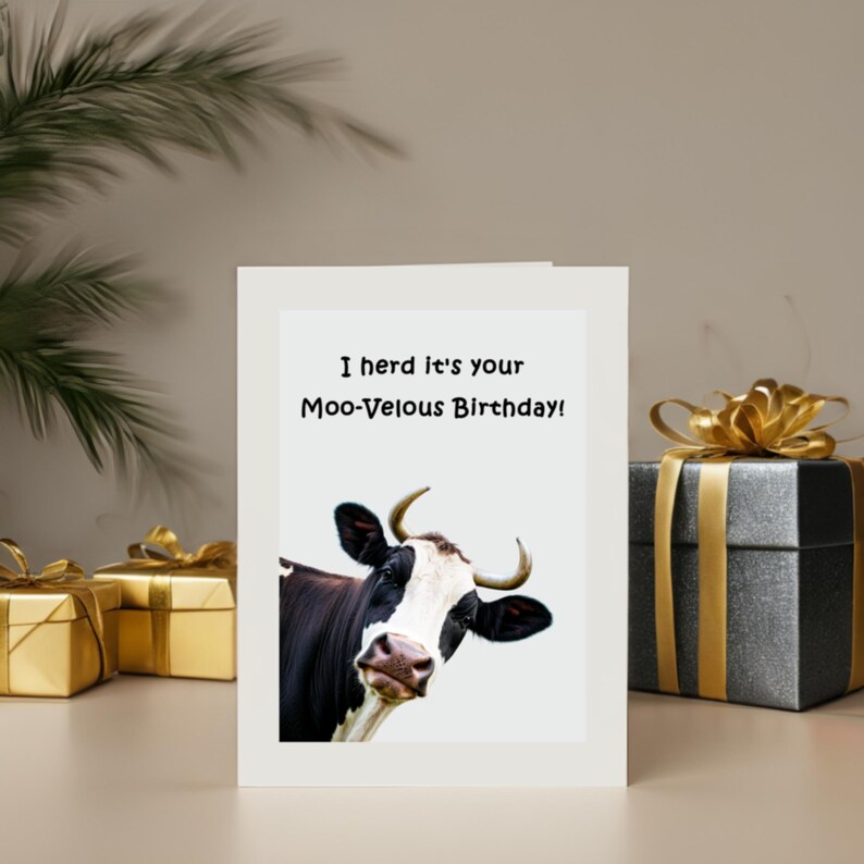 Set in front of colorful presents, the 'Moo-velous Birthday' Card adds a delightful and lively touch to the party.